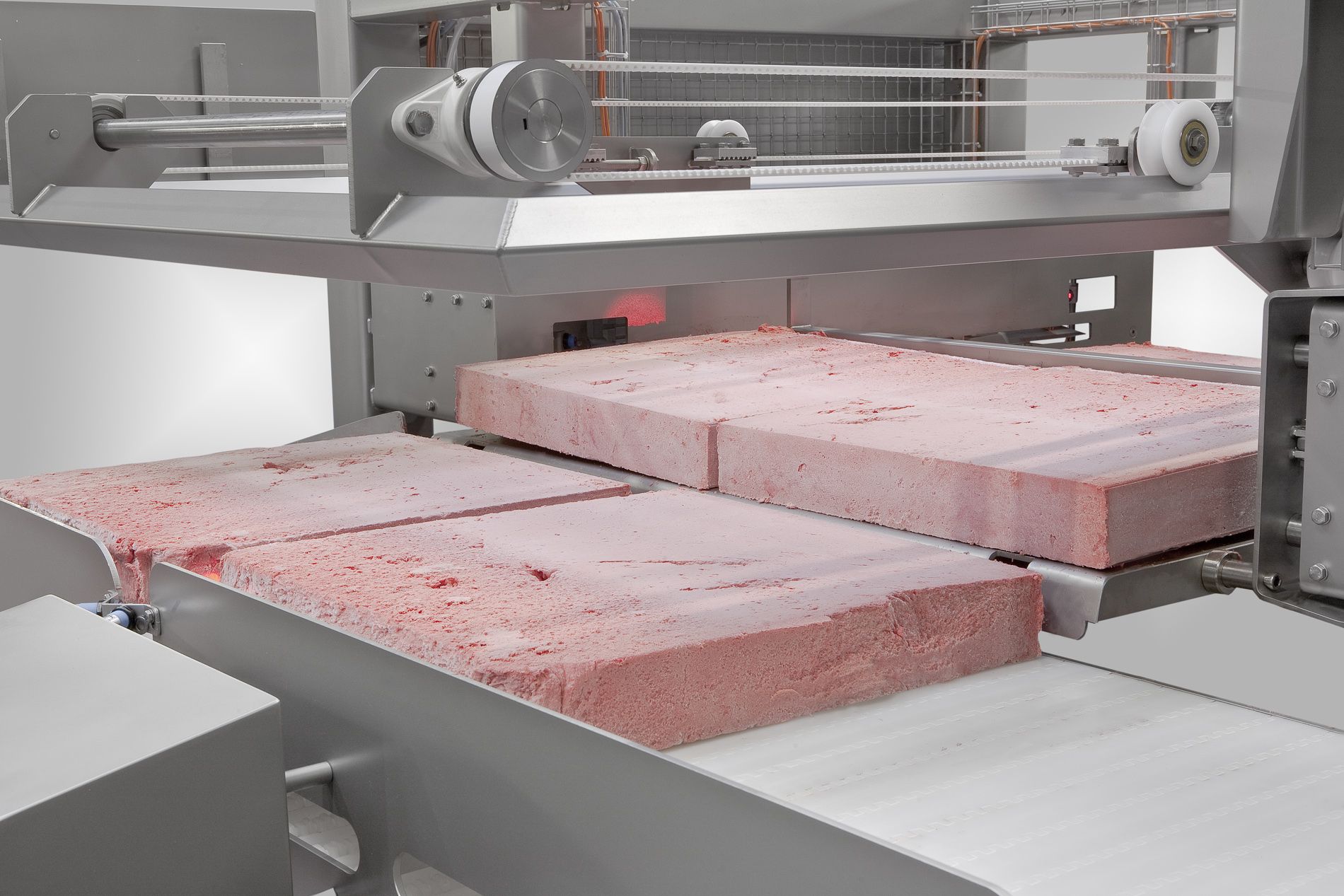 Frozen meat conveyor system